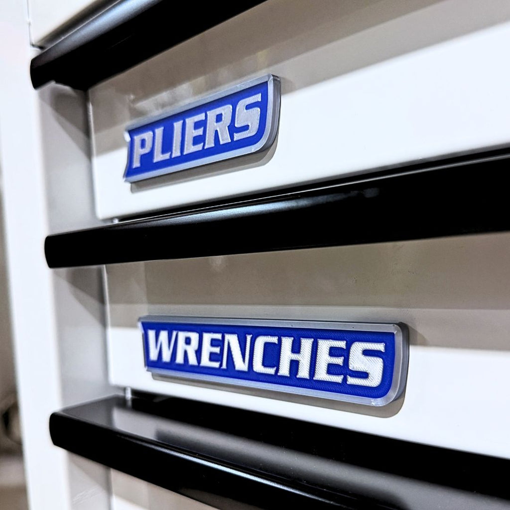 Silver and blue toolbox labels on a tool chest