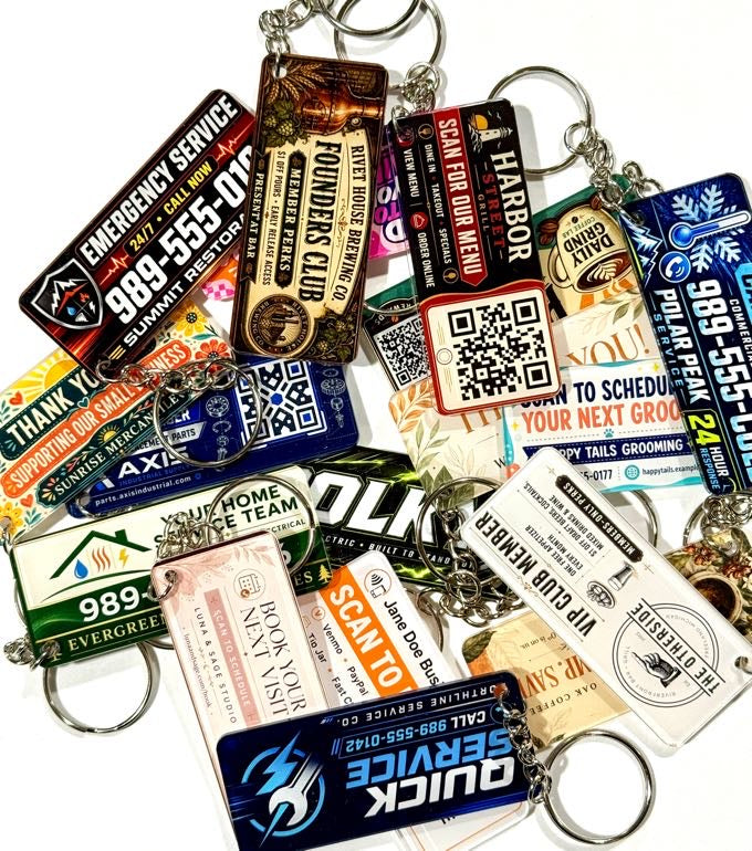 Pile of UV-printed acrylic keytags with mixed customer designs