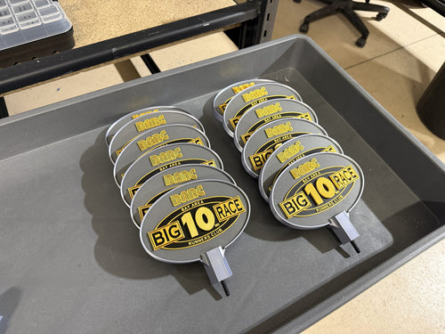 Tray of event trophy toppers