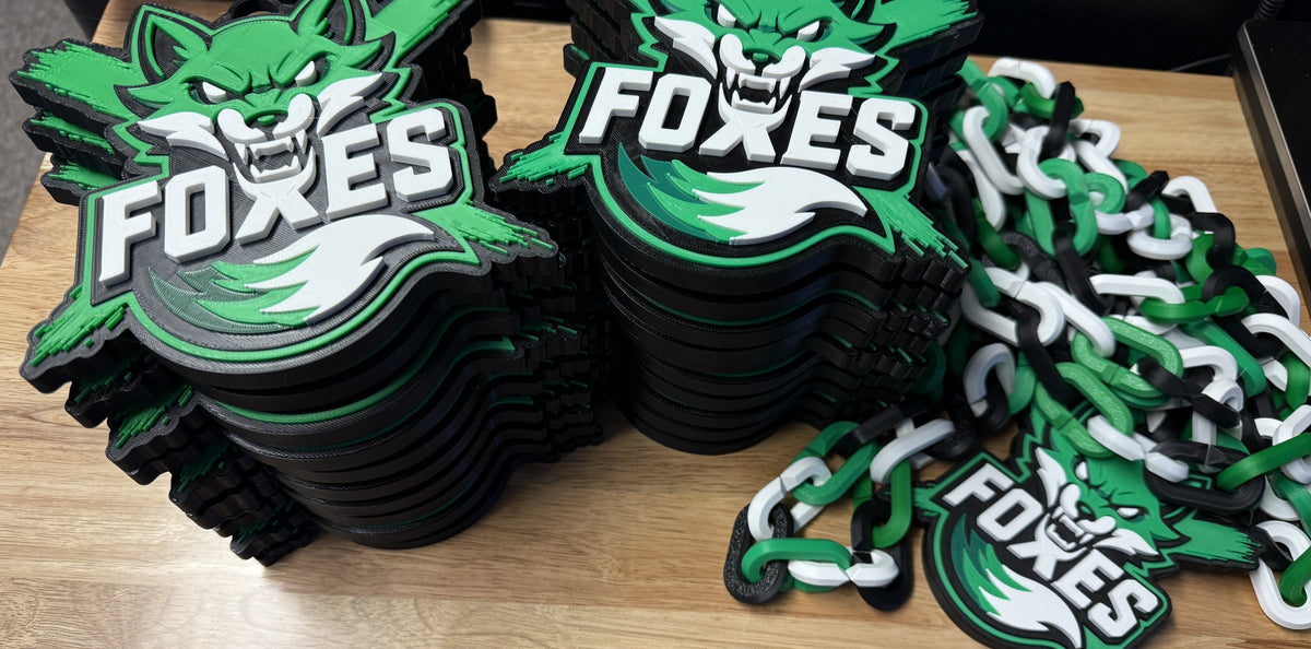 Stack of team pendant chains with school logos